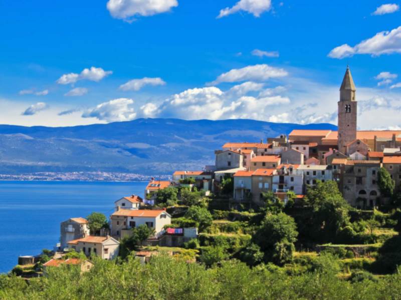 Adriatic Town of Vrbnik in front of blue sea, Island of Krk, Croatia